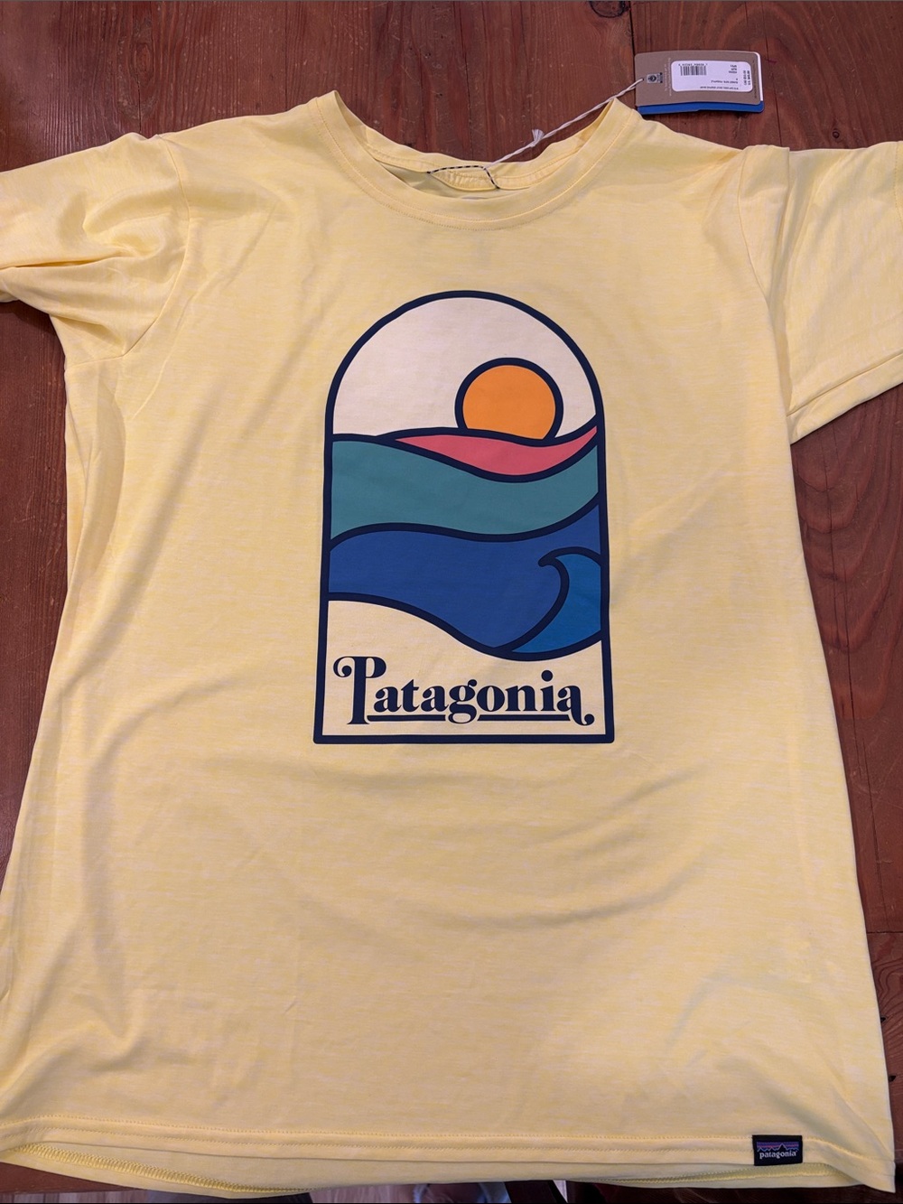 NWT Women’s Patagonia Yellow Graphic Tee with Sunset Wave Design size small